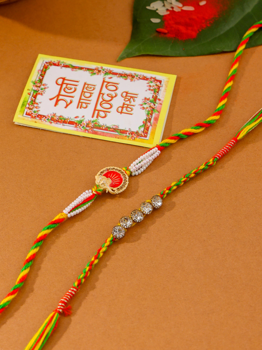 NVR Men Set of 2 Religious Designer Multicolor Artificial Stones Thread Rakhi with Roli Chawal Chandan & Mishri - Distacart