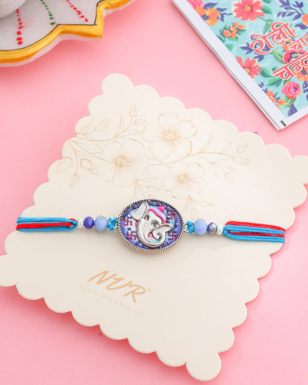 NVR Men Red & Blue Ganesh Ji Thread Rakhi with Roli Chawal Chandan & Mishri - Distacart