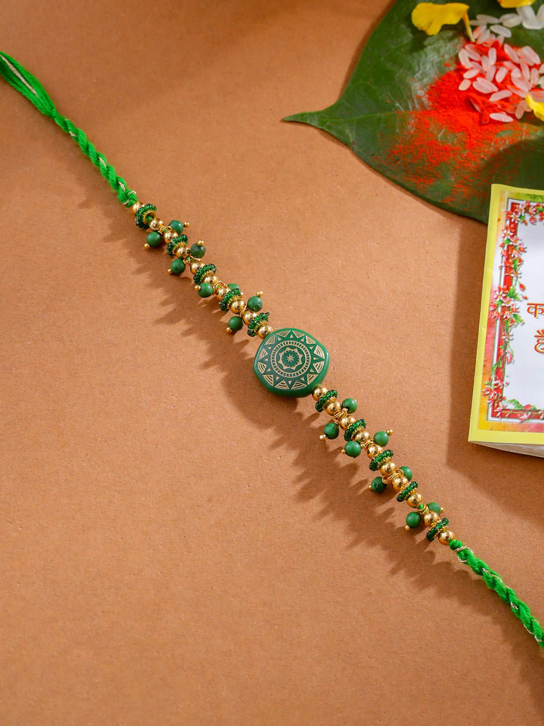 NVR Men Green Artificial Beads Round Shape Thread Rakhi with Roli Chawal Chandan & Mishri - Distacart