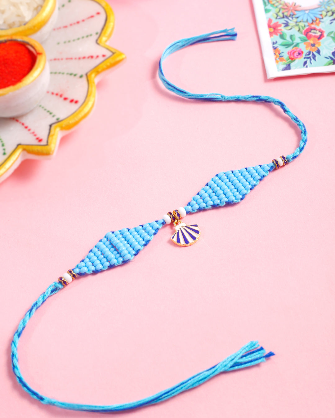 NVR Men Blue Pearls Unique Design Thread Rakhi with Roli Chawal Chandan & Mishri - Distacart