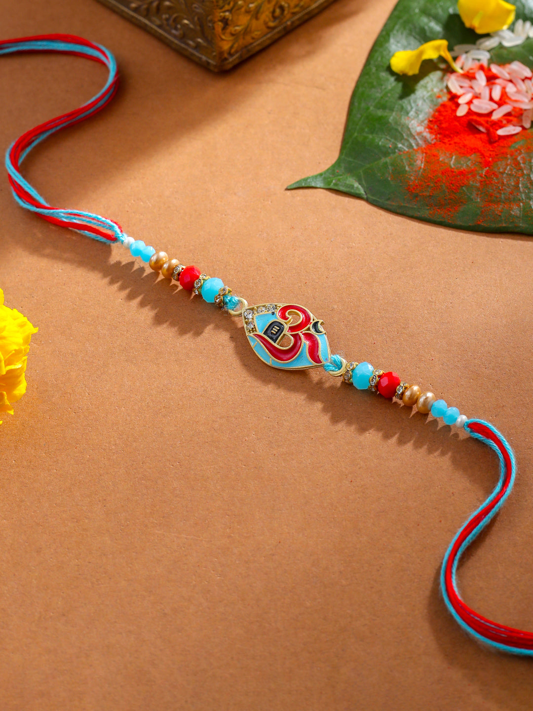 NVR Men Red & Blue Artificial Stones and Beads Om Thread Rakhi with Roli Chawal Chandan & Mishri - Distacart