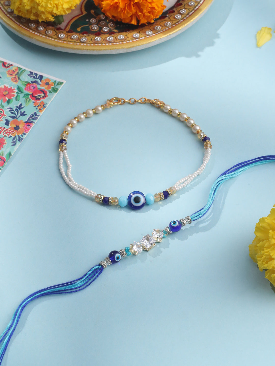 NVR Set of 2 Blue Evil Eye Artificial Stones & Beads Bhaiya Bhabhi Rakhi with Roli Chawal Chandan & Mishri - Distacart