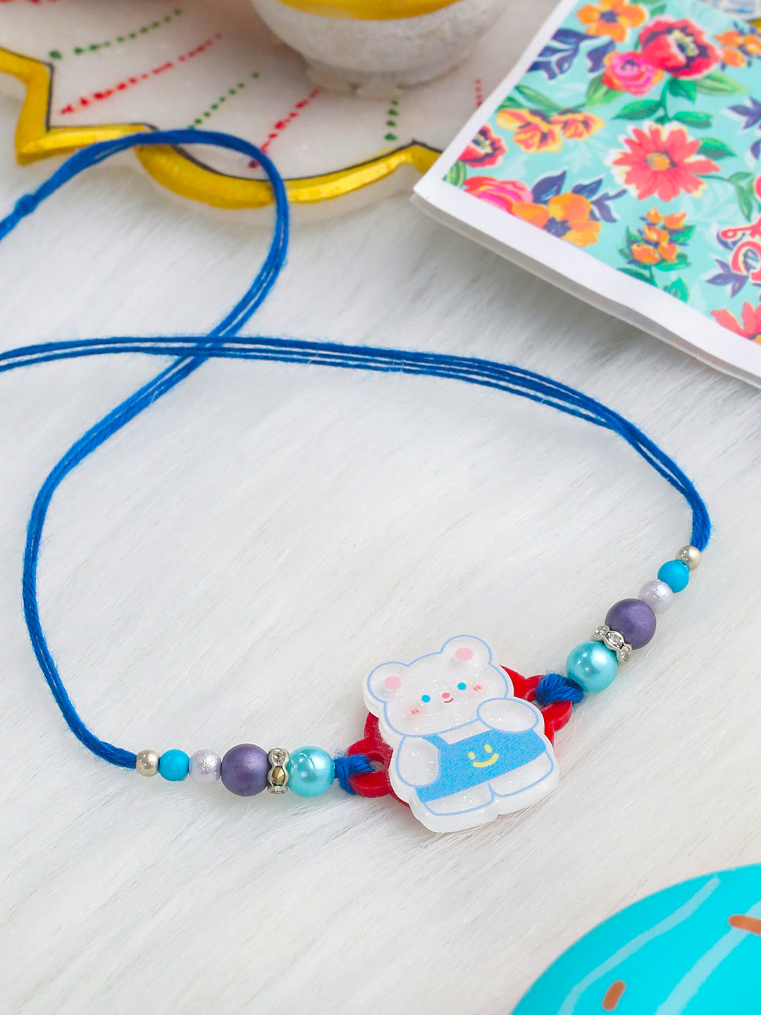 NVR Kids Teddy Blue Artificial Beads Thread Rakhi with Roli Chawal Chandan & Mishri - Distacart