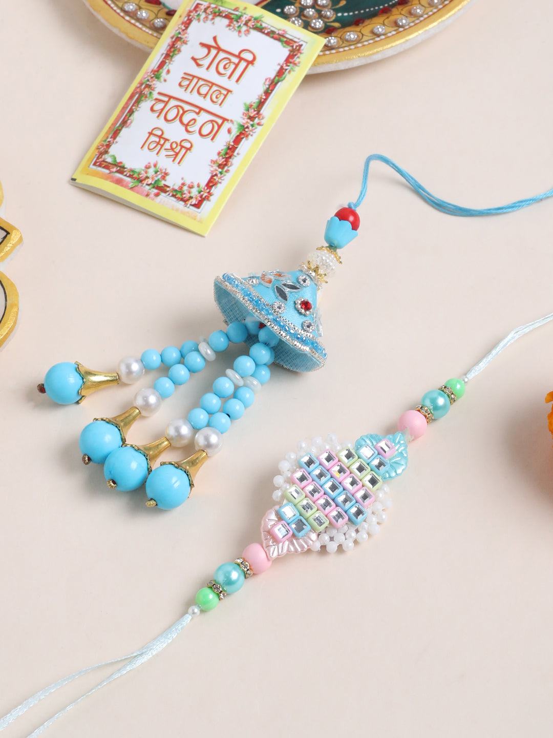 NVR Set of 2 Blue & Pink Artificial Stones & Beads Bhaiya Bhabhi Rakhi with Roli Chawal Chandan & Mishri - Distacart