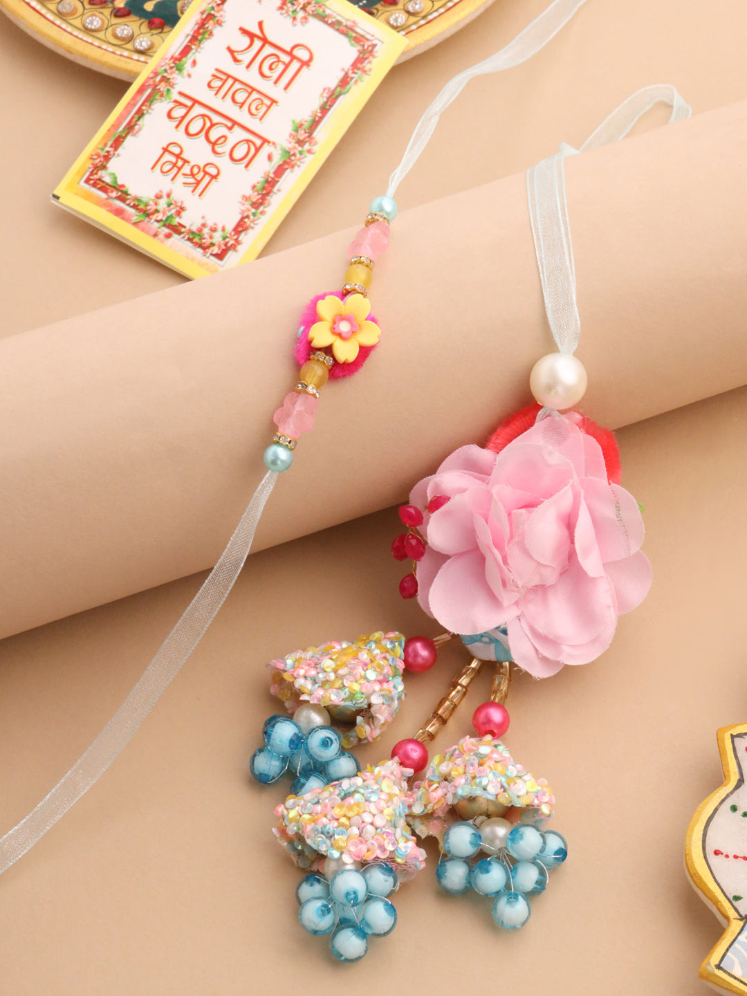 NVR Set of 2 Multicolor Artificial Beads Floral Design Bhaiya Bhabhi Rakhi with Roli Chawal Chandan & Mishri - Distacart