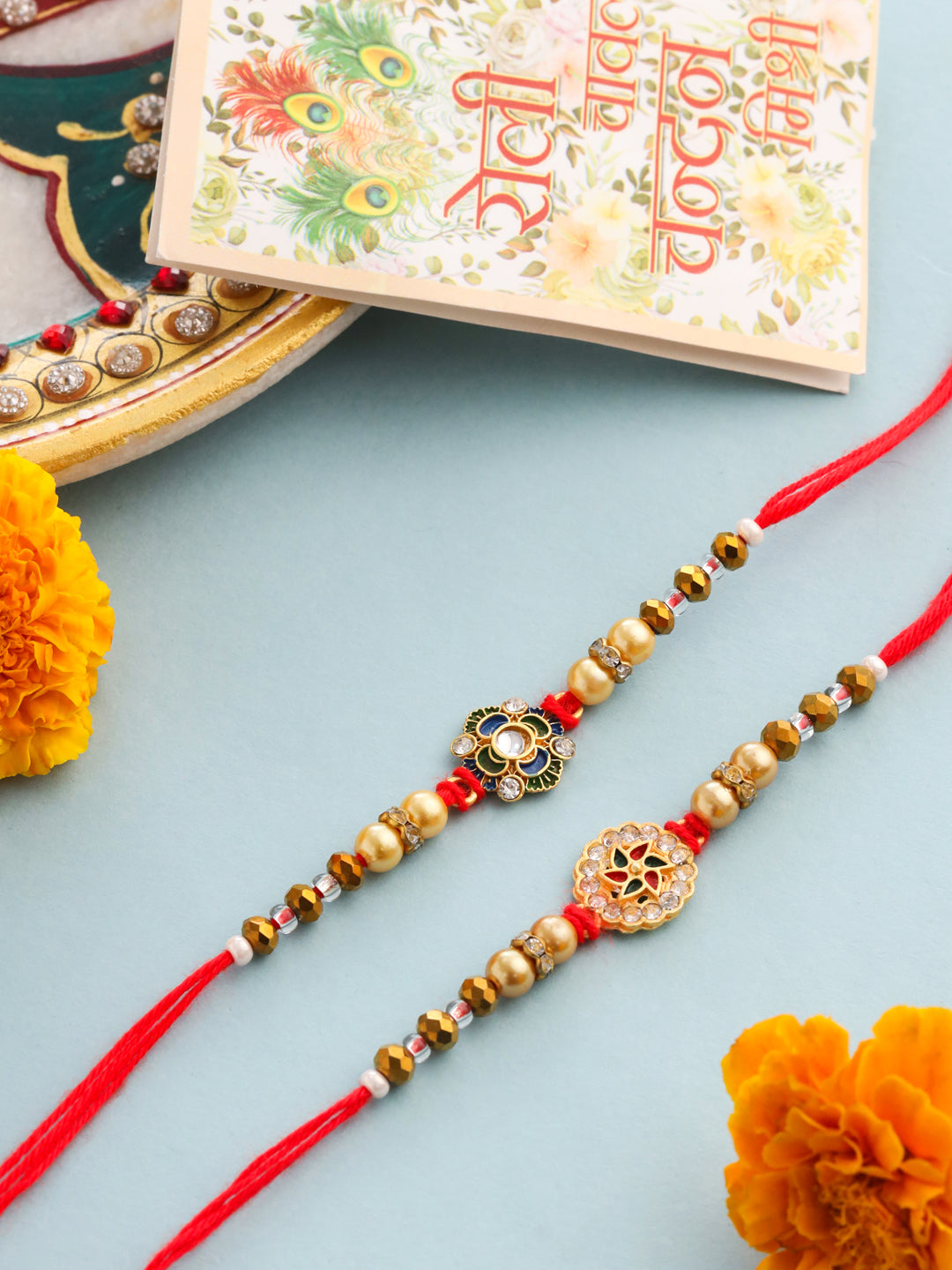NVR Men Set of 2 Red & Gold Floral Design Artificial Stones & Beads Thread Rakhi With Roli Chawal Chandan & Mishri