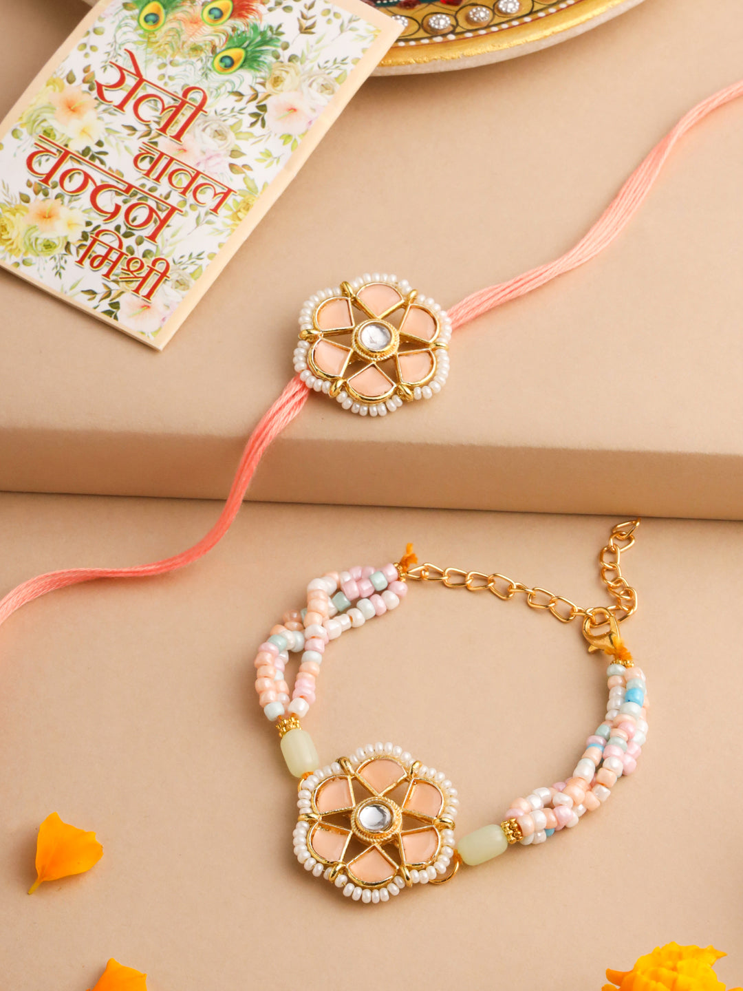 NVR Set of 2 Peach Color Artificial Stones & Pearls Bhaiya Bhabhi Rakhi With Roli Chawal Chandan & Mishri
