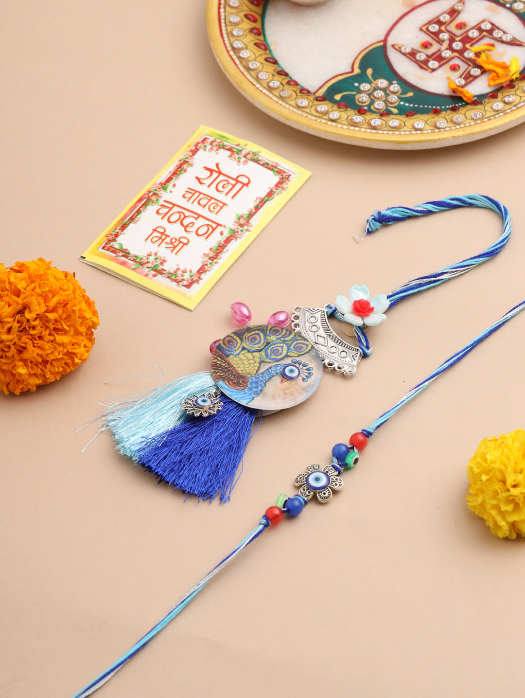NVR Set of 2 Blue Evil Eye & Peacock Design Artificial Beads Bhaiya Bhabhi Rakhi With Roli Chawal Chandan & Mishri