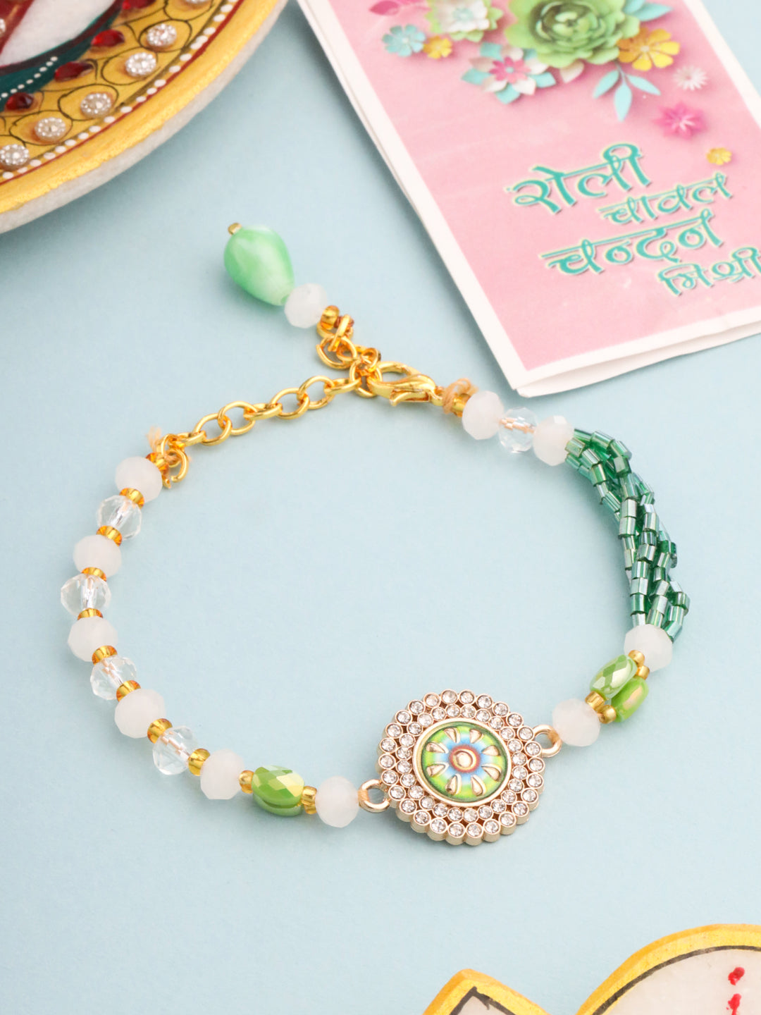 NVR Women Green Artificial Stones & Beads Floral Wraparound Rakhi with Roli Chawal Chandan & Mishri - Distacart