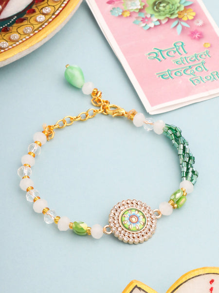 NVR Women Green Artificial Stones & Beads Floral Wraparound Rakhi with Roli Chawal Chandan & Mishri