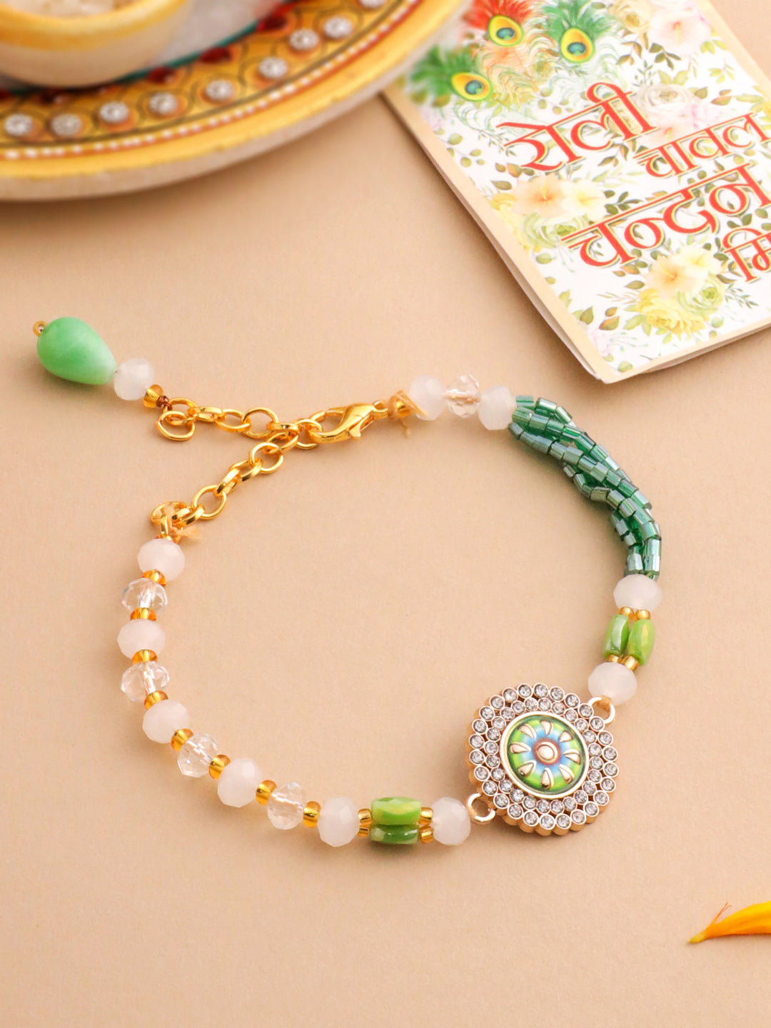 NVR Women Green Artificial Stones & Beads Floral Wraparound Rakhi with Roli Chawal Chandan & Mishri