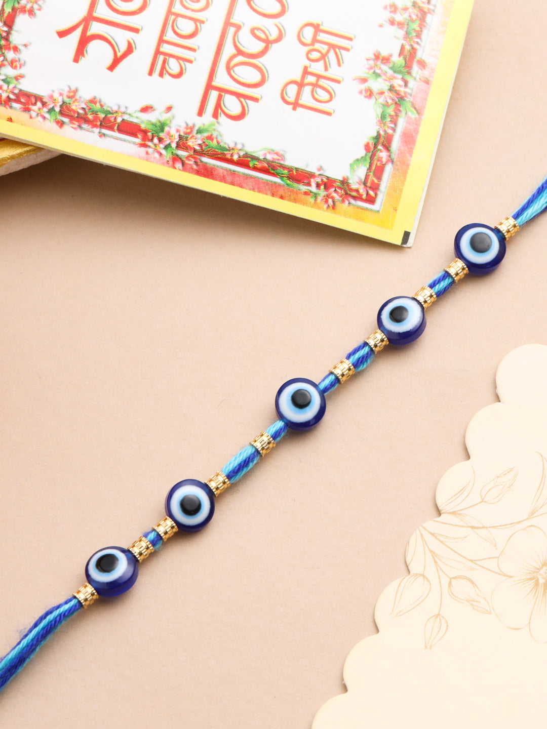 NVR Men's Blue Evil Eye Thread Rakhi with Roli Chawal Chandan & Mishri