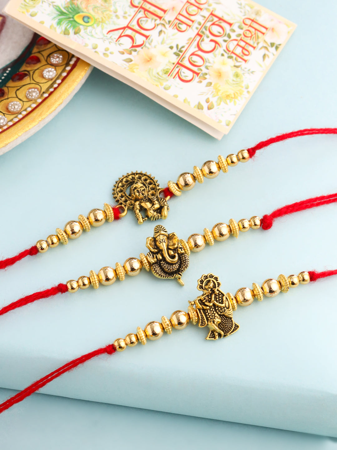 NVR Men Set of 3 Gold Toned Designer Ganesh Ji Thread Rakhi with Roli Chawal Chandan & Mishri - Distacart