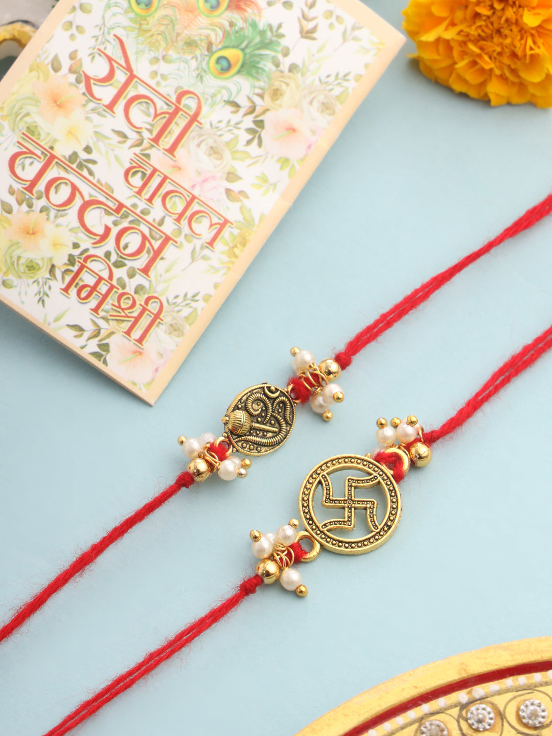 NVR Men Set of 2 Gold Toned Pearls Swastik Desgin Thread Rakhi with Roli Chawal Chandan & Mishri - Distacart