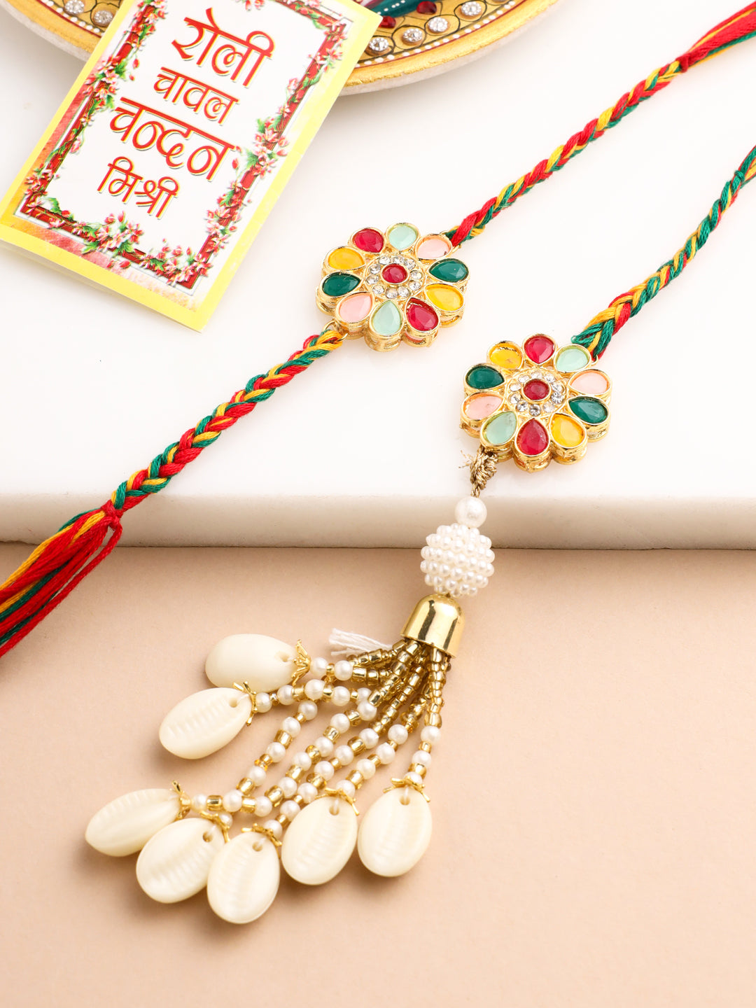 NVR Set of 2 Artificial Beads & Sea Shell Floral Design Bhaiya Bhabhi Rakhi with Roli Chawal Chandan & Mishri - Distacart
