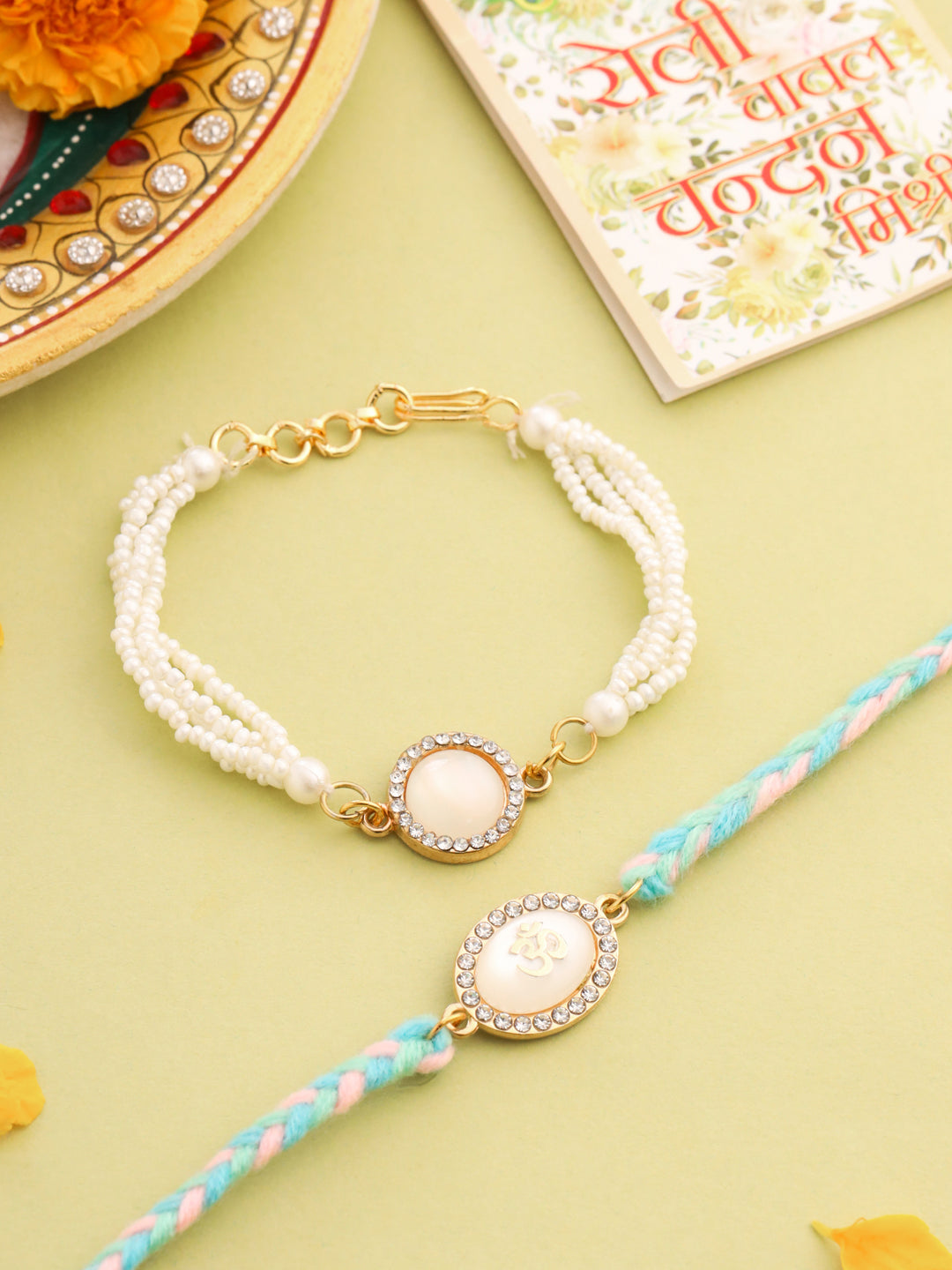 NVR Set of 2 White Pearls & Artificial Beads Bhaiya Bhabhi Rakhi with Roli Chawal Chandan & Mishri - Distacart