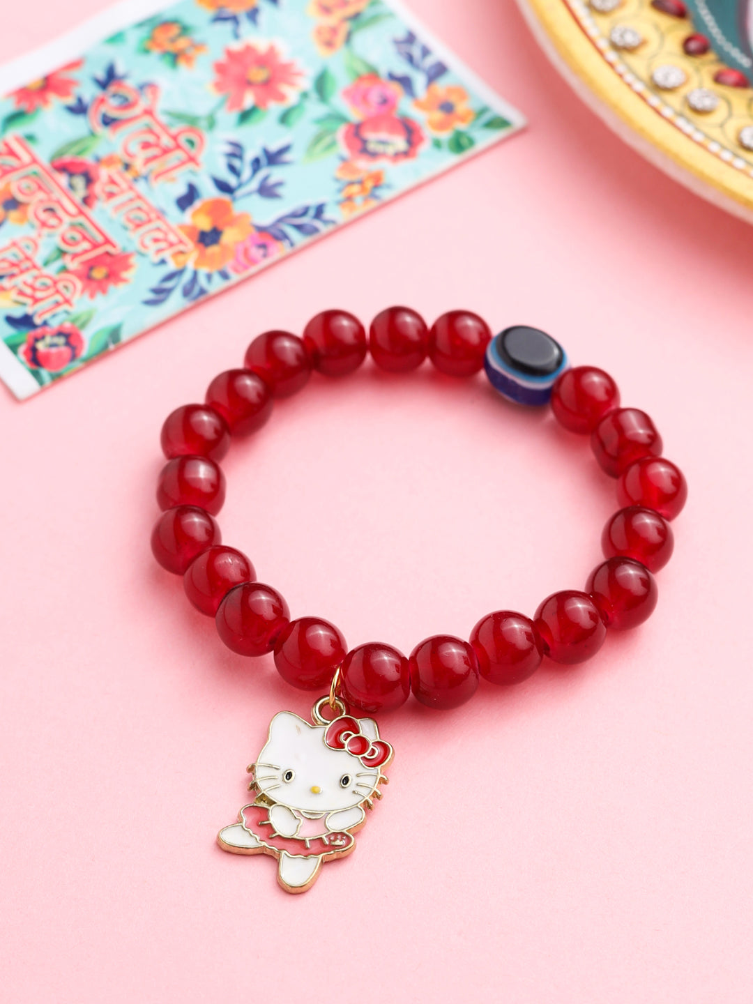 NVR Kids Cartoon Design Maroon Artificial Beads Thread Rakhi with Roli Chawal Chandan & Mishri - Distacart