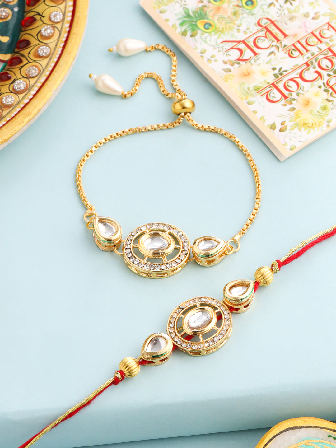 NVR Set of 2 Gold Toned Kundan Studded Bhaiya Bhabhi Rakhi with Roli Chawal Chandan & Mishri - Distacart