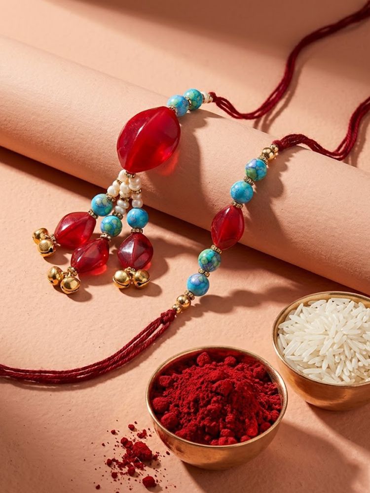 NVR Set of 2 Artificial Beads & Gold Toned Ghungroo Bhaiya Bhabhi Rakhi with Roli Chawal - Dista