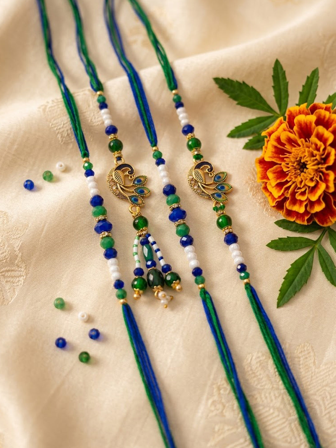 NVR Set of 4 Green Peacock Design Artificial Beads Thread Rakhi with Roli Chawal - Dista