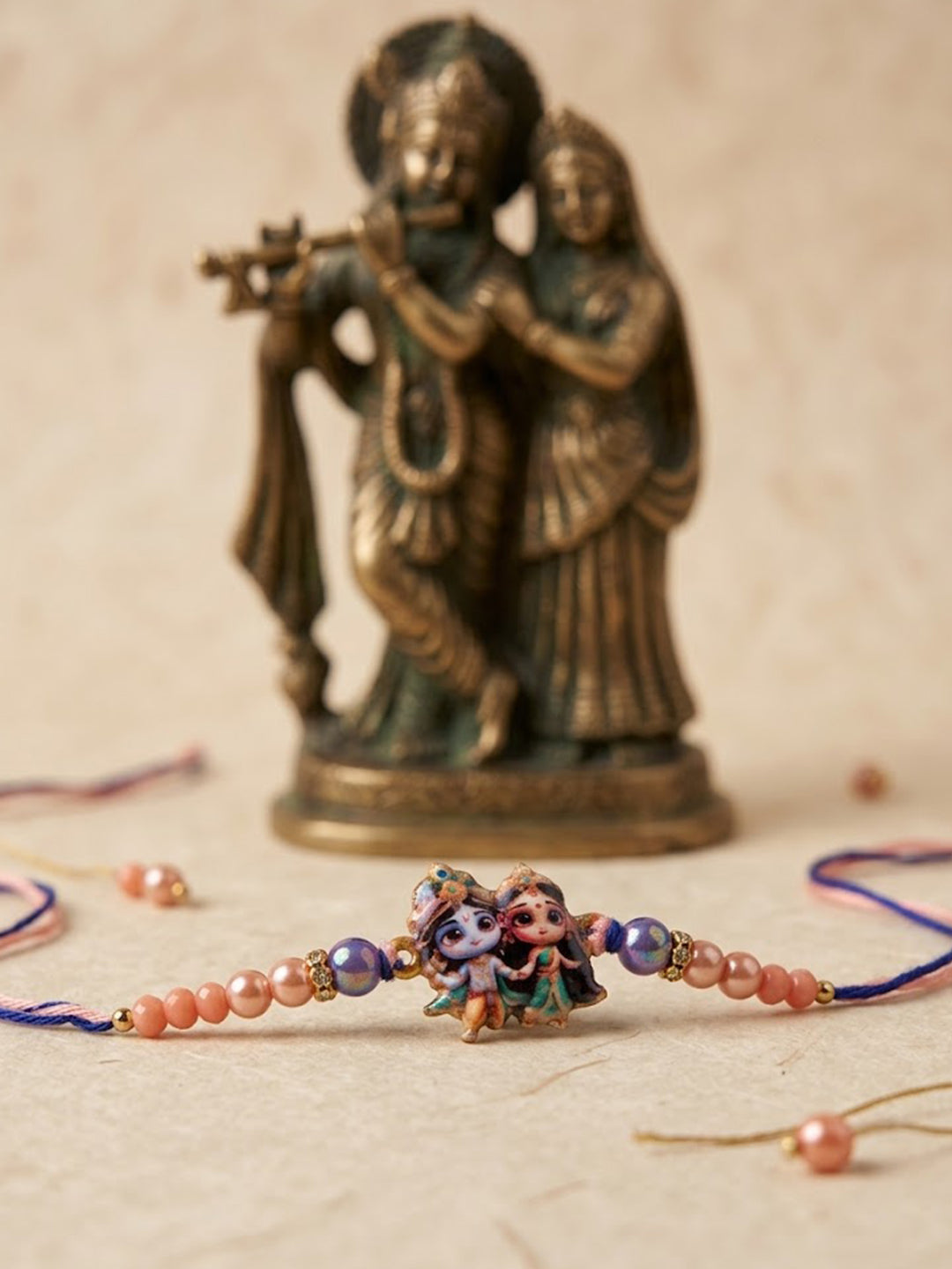 NVR Radha Krishna Multicolor Artificial Beads Thread Rakhi With Roli Chawal Chandan Mishri - Dista