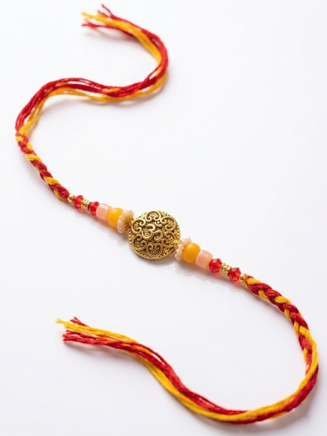 NVR Artificial Beads Decorative Om Design Religious Thread Rakhi with Roli Chawal Chandan - Dista