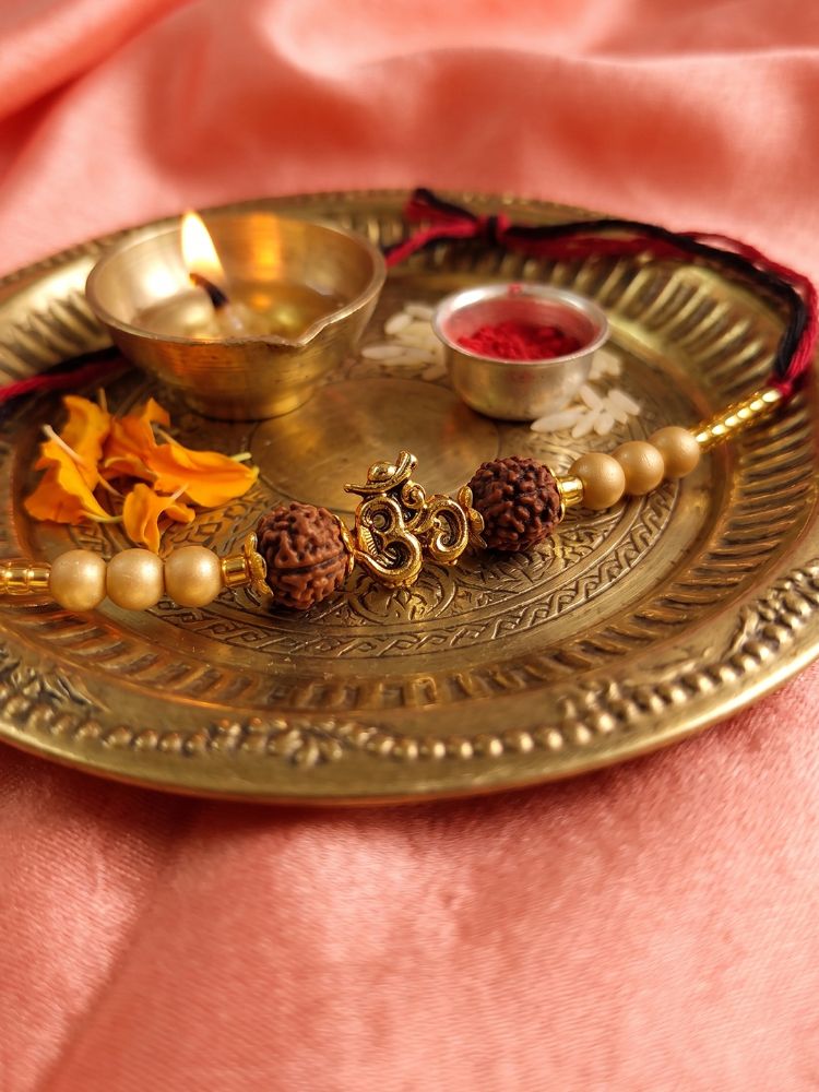 NVR Om Design Rudraksh Thread Rakhi with Roli Chawal Chandan Mishri - Dista