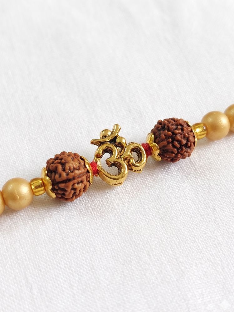NVR Om Design Rudraksh Thread Rakhi with Roli Chawal Chandan Mishri - Dista