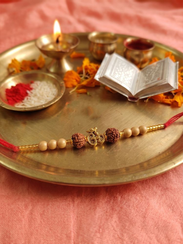 NVR Om Design Rudraksh Thread Rakhi with Roli Chawal Chandan Mishri - Dista