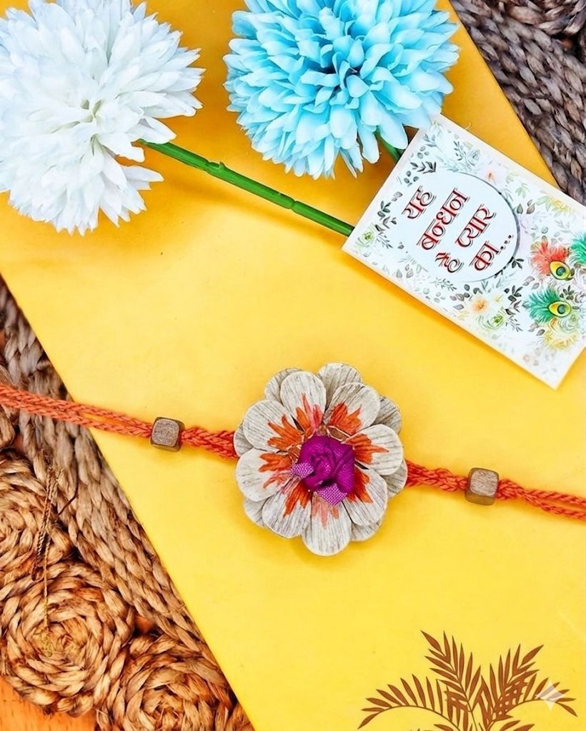 NVR Multicolor Floral Design Plant Seed Rakhi with Roli Chawal Chandan Mishri - Dista