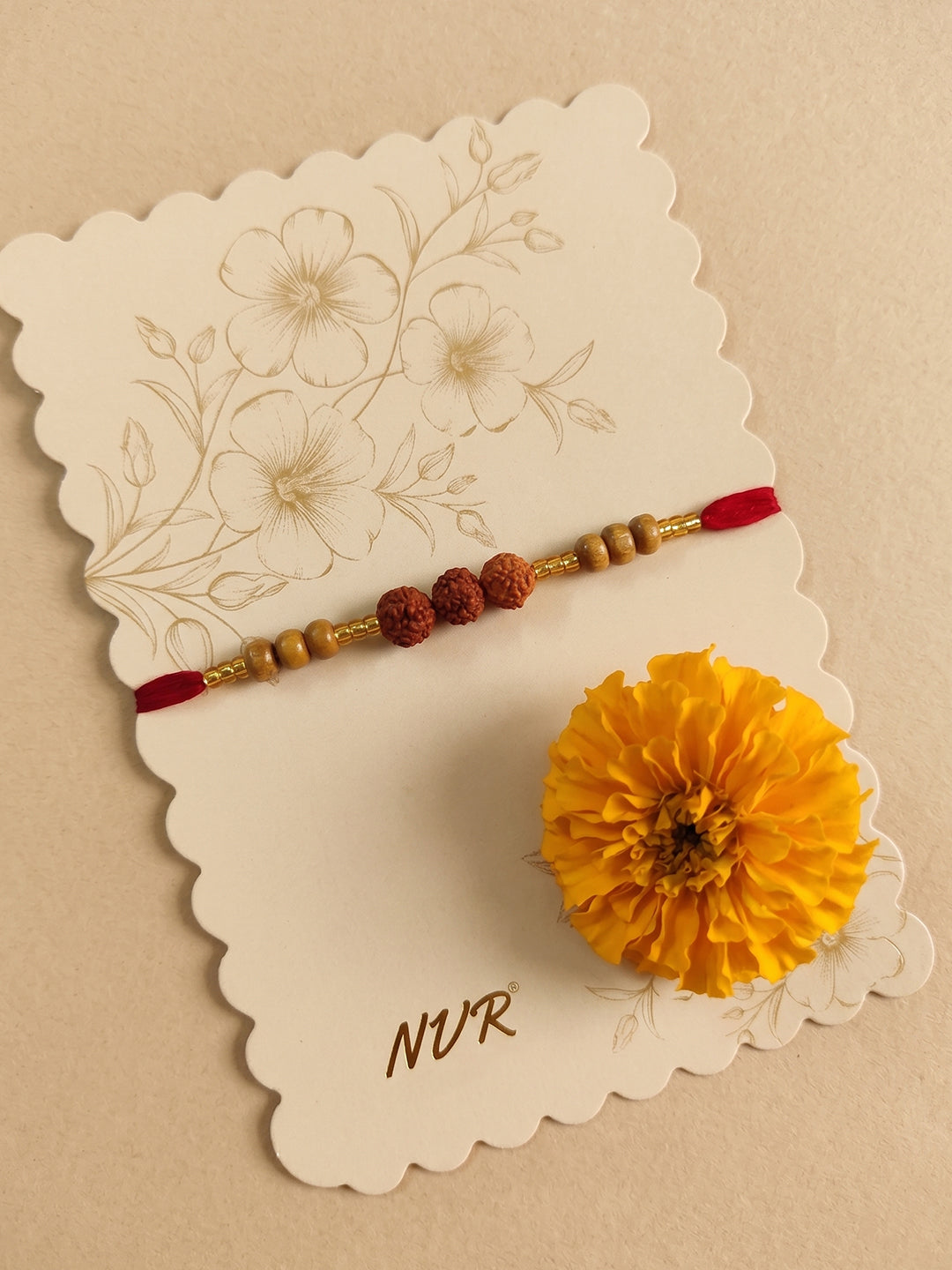 NVR Religious Rudraksh & Red Thread Rakhi with Roli Chawal Chandan Mishri - Dista