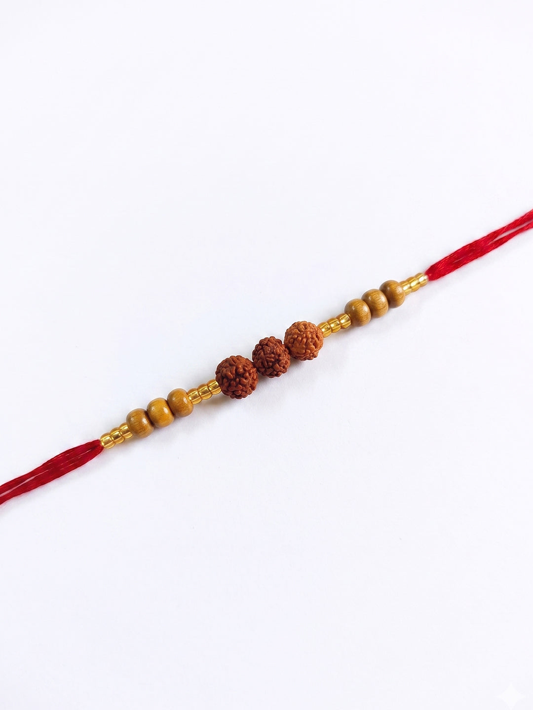 NVR Religious Rudraksh & Red Thread Rakhi with Roli Chawal Chandan Mishri - Dista