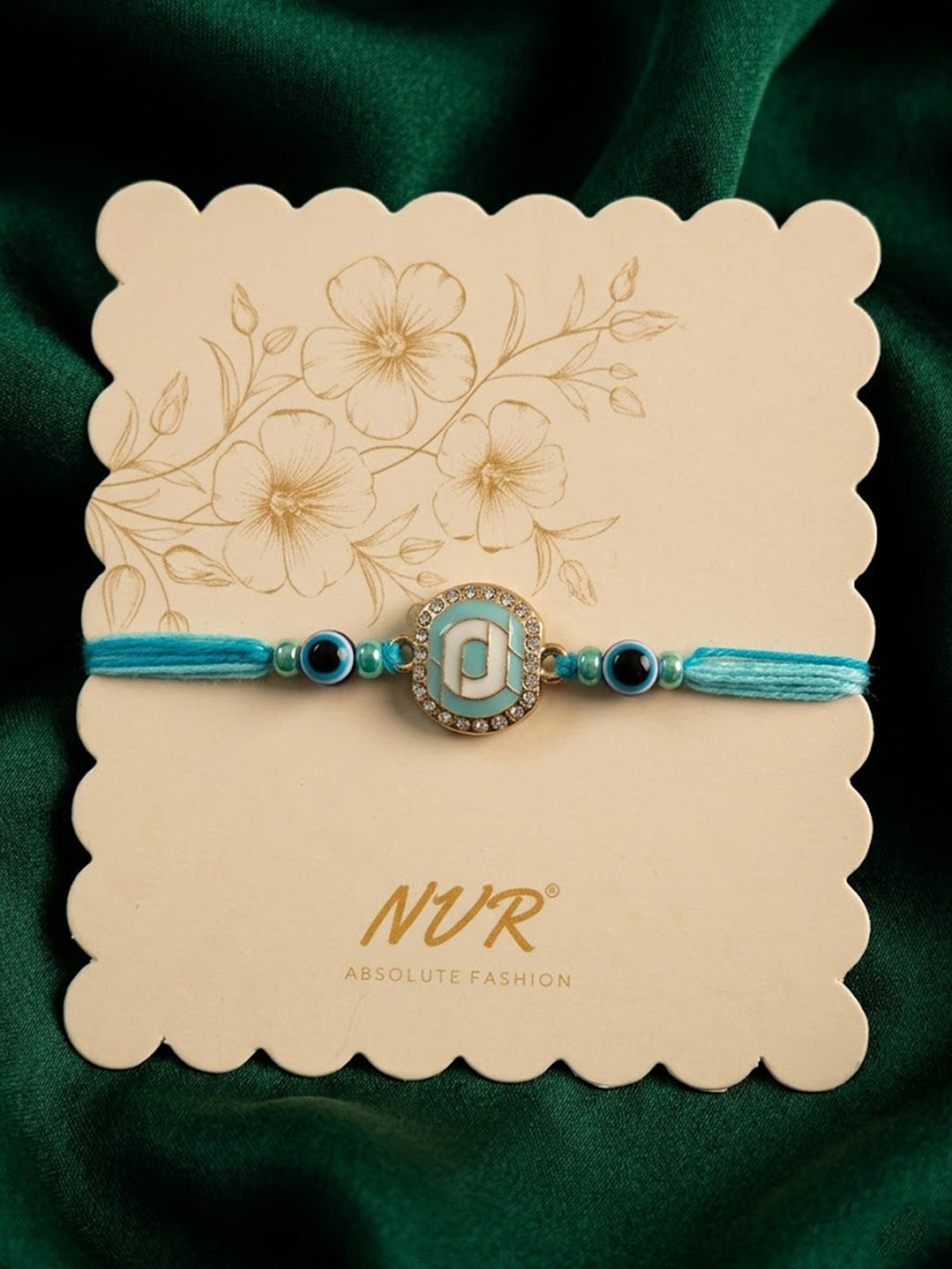 NVR Blue Evil Eye & Artificial Stones Oval Shape Thread Rakhi with Roli Chawal Chandan - Dista