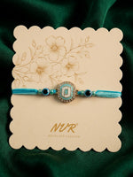 Thumbnail for NVR Blue Evil Eye & Artificial Stones Oval Shape Thread Rakhi with Roli Chawal Chandan - Dista