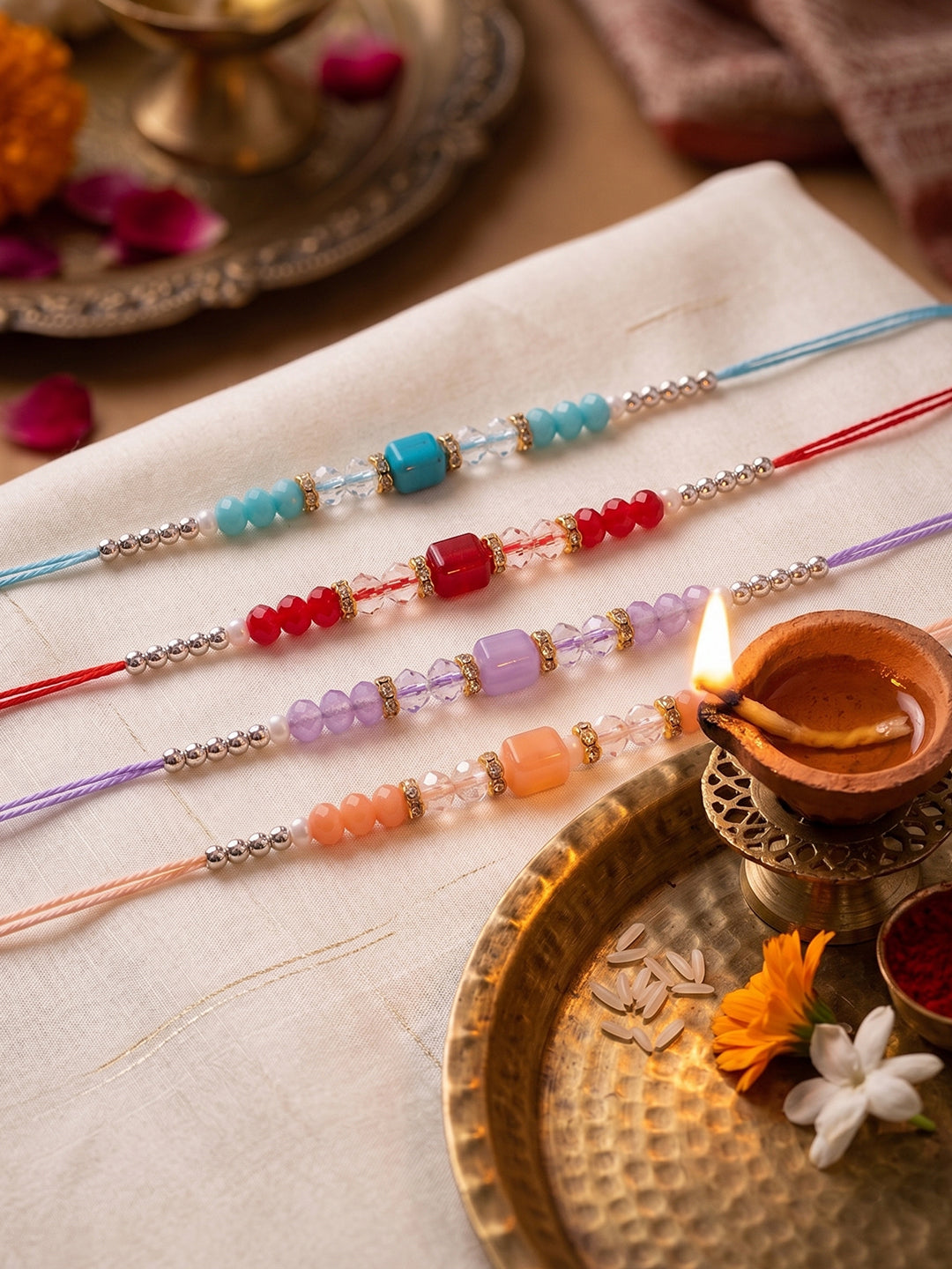 NVR Set of 4 Multicolor Artificial Beads Thread Rakhi with Roli Chawal Chandan Mishri - Dista