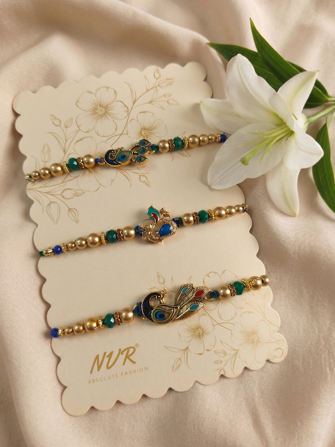 NVR Set of 3 Peacock Design Multicolor Artificial Beads Thread Rakhi With Roli Chawal - Dista