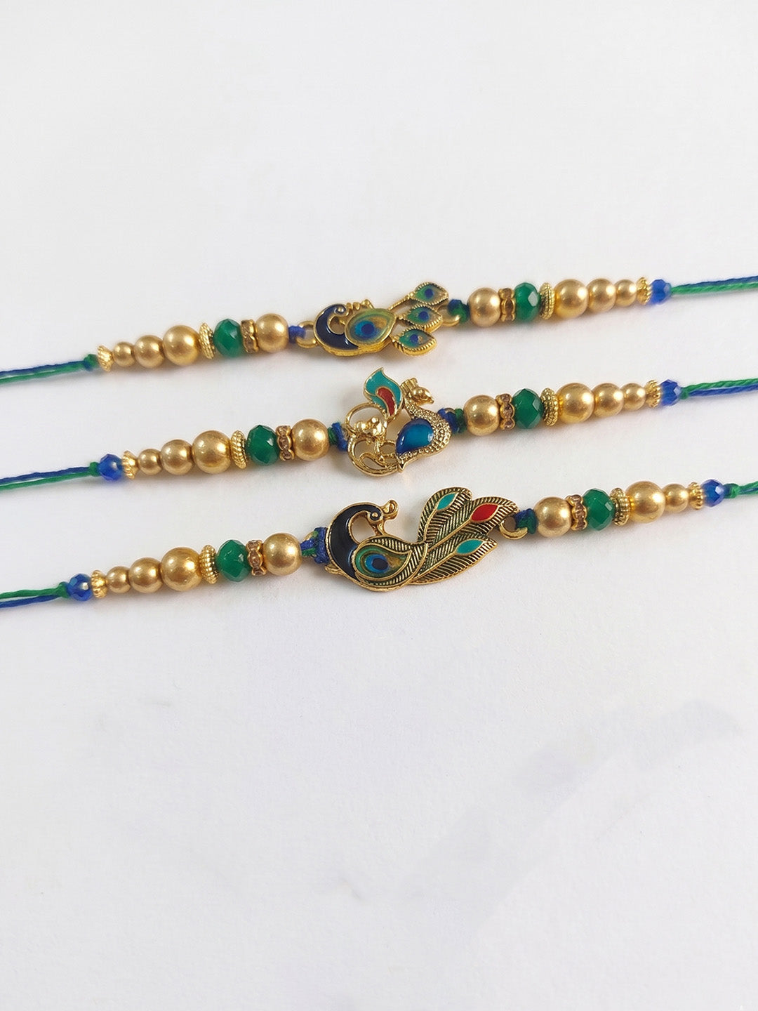 NVR Set of 3 Peacock Design Multicolor Artificial Beads Thread Rakhi With Roli Chawal - Dista