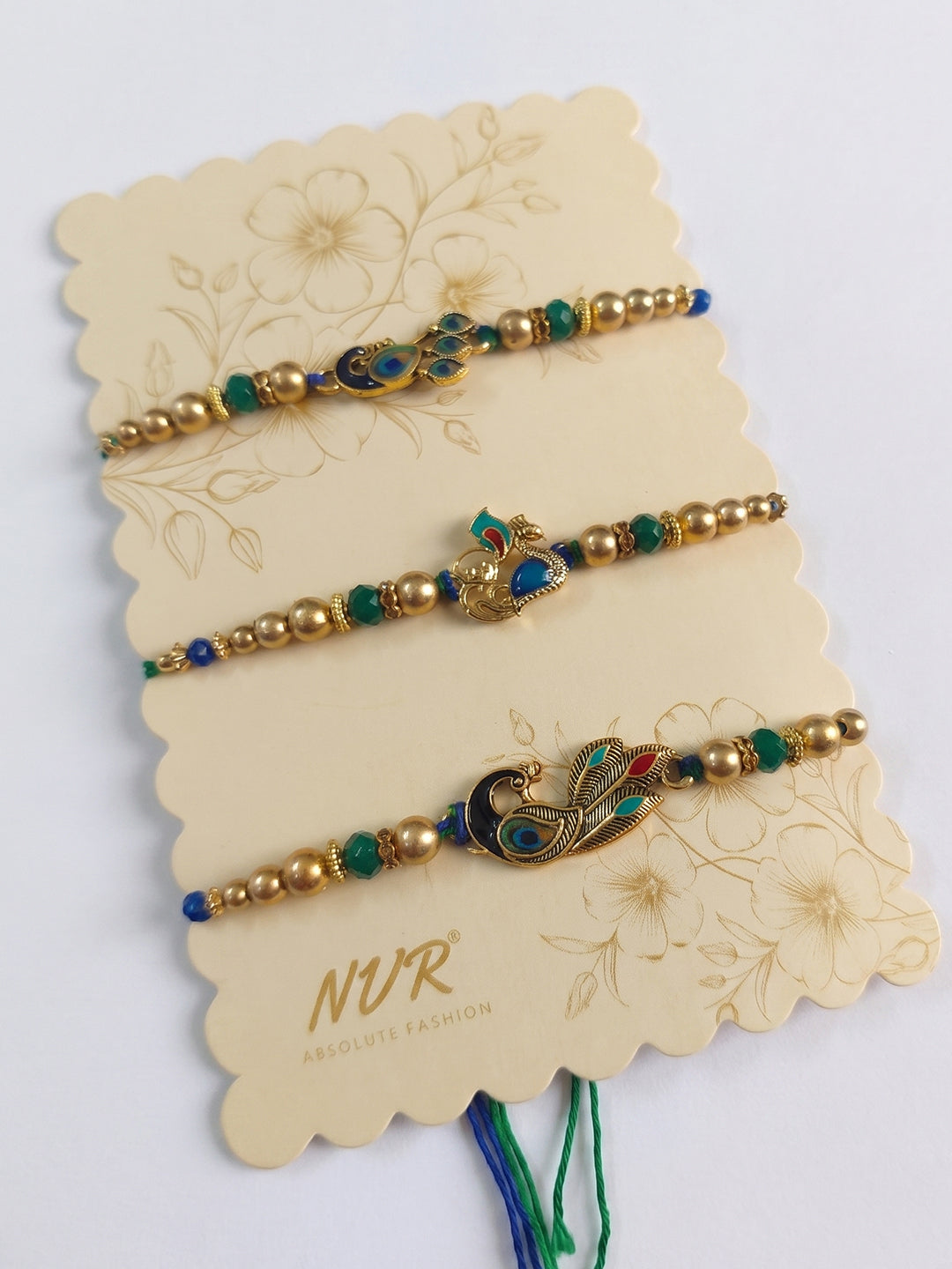 NVR Set of 3 Peacock Design Multicolor Artificial Beads Thread Rakhi With Roli Chawal - Dista