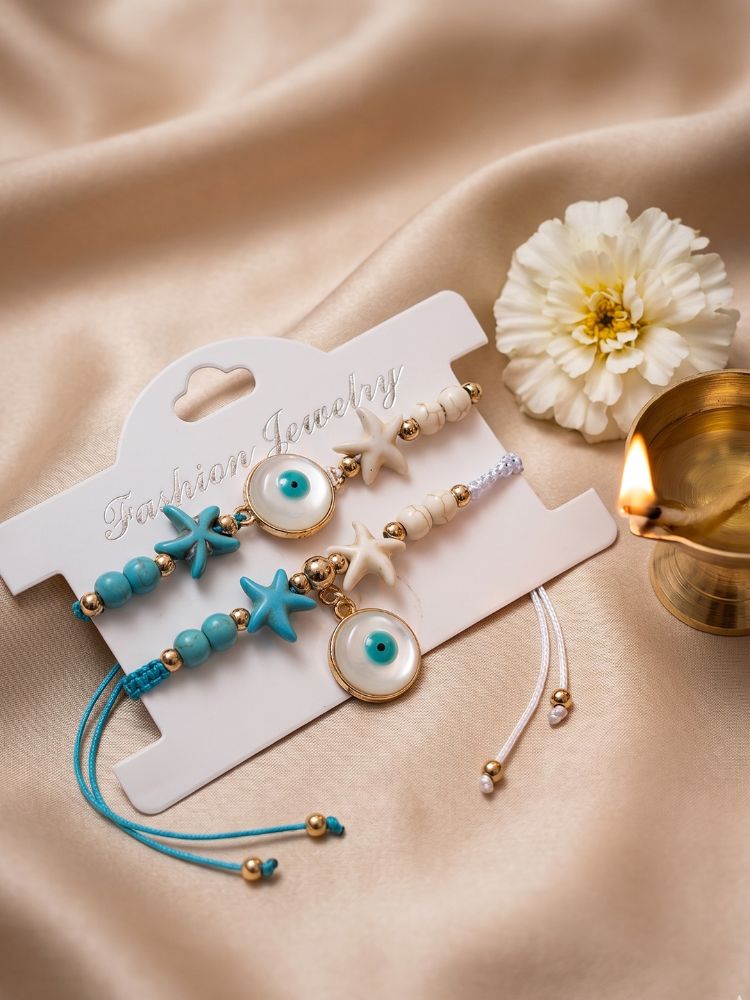 NVR Set of 2 Blue Evil Eye & White Pearl Bhaiya Bhabhi Rakhi with Roli Chawal Chandan - Dista