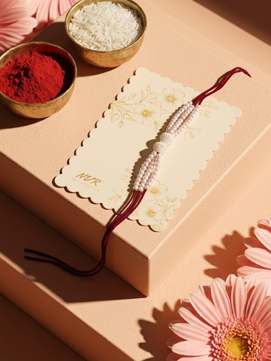 NVR White Pearls & Red Thread Rakhi with Roli Chawal Chandan Mishri - Dista