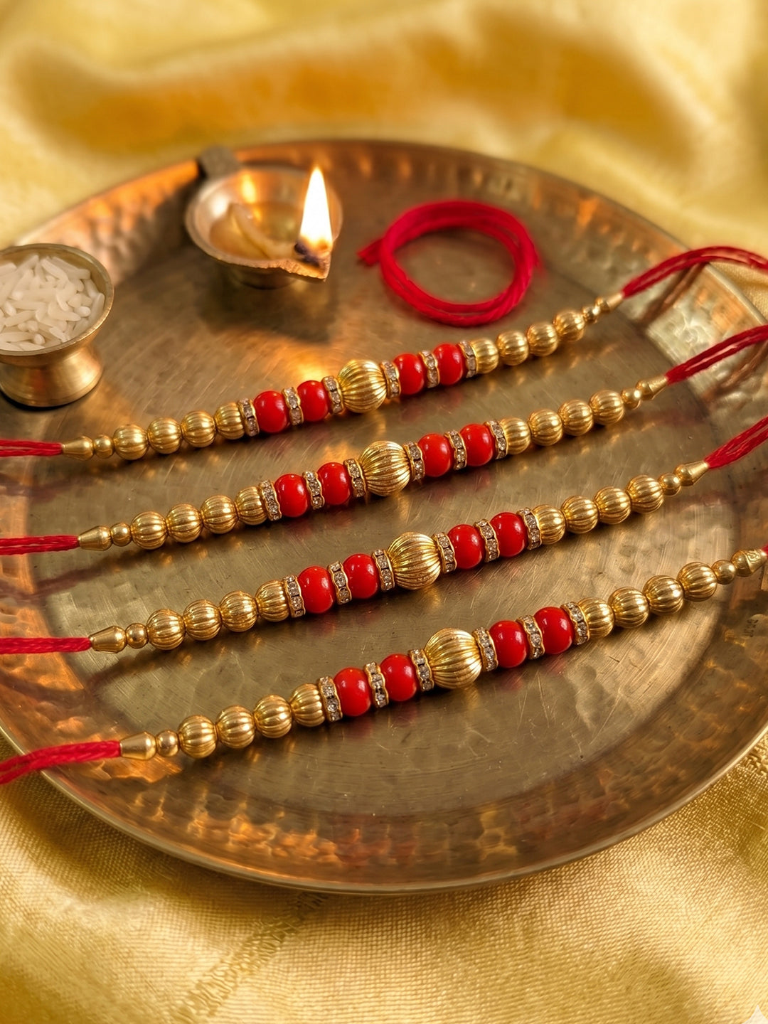 NVR Set of 4 Artificial Beads Red Thread Rakhi With Roli Chawal Chandan Mishri - Dista
