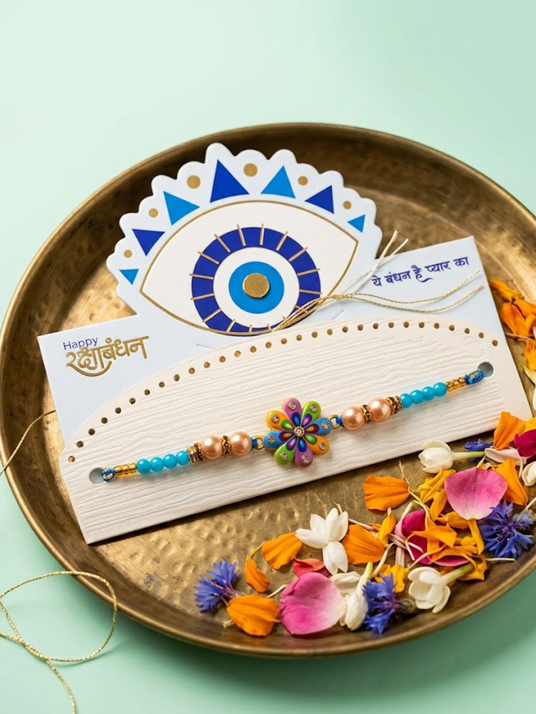 NVR Artificial Beads Flower Shape Multicolor Thread Rakhi with Roli Chawal Chandan Mishri - Dista