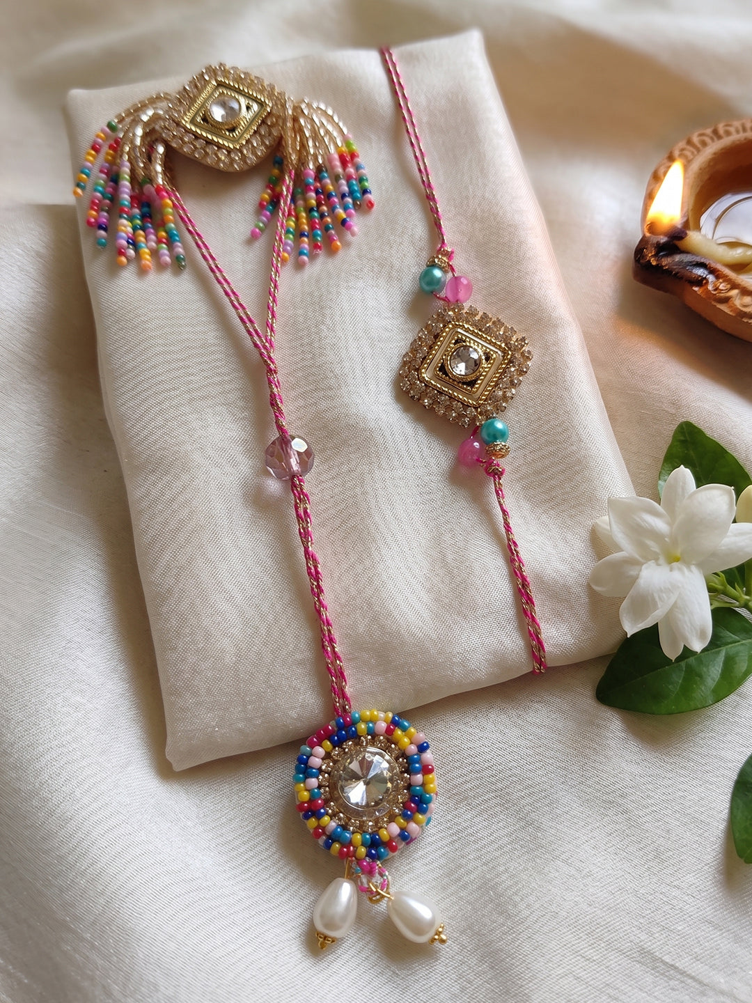NVR Set of 2 White Artificial Stones Golden Toned Bhaiya Bhabhi Rakhi With Roli Chawal - Dista
