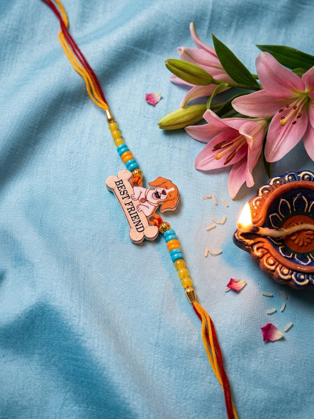NVR Stylish Artificial Beads Kids Thread Rakhi with Roli Chawal Chandan Mishri - Dista