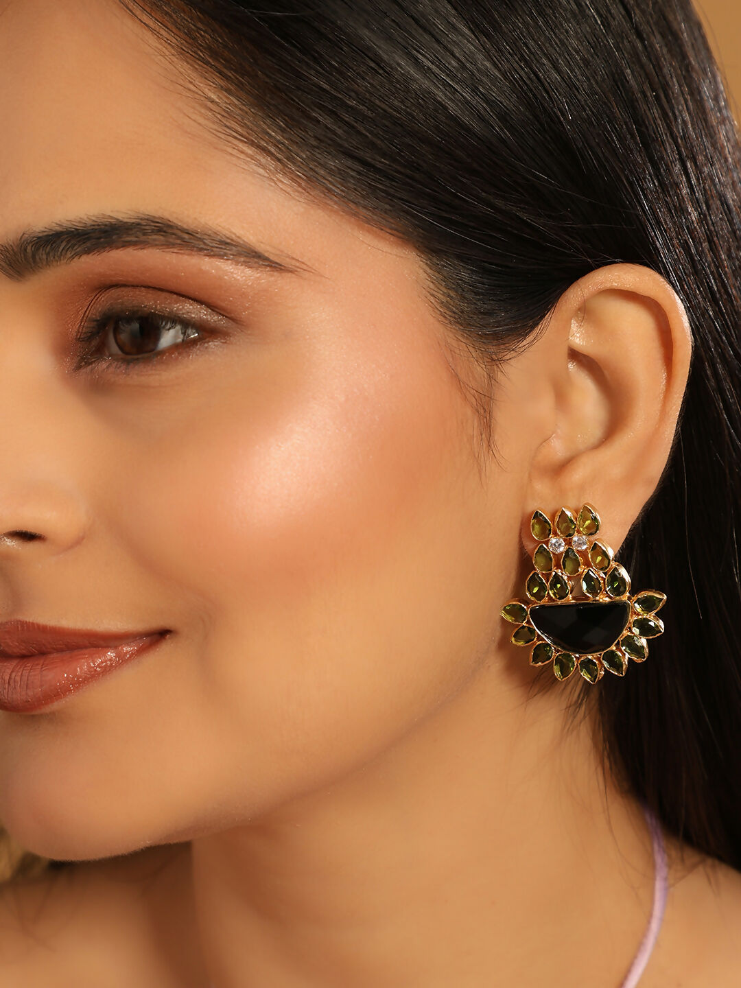 Nuyug 22K Gold Plated Dark Crystal Studded Contemporary Floral Shaped Stud Earrings