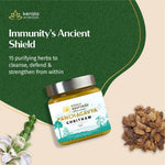 Thumbnail for Jar of Kerala Ayurveda Panchagavya Ghritam with herbs on a green and beige background