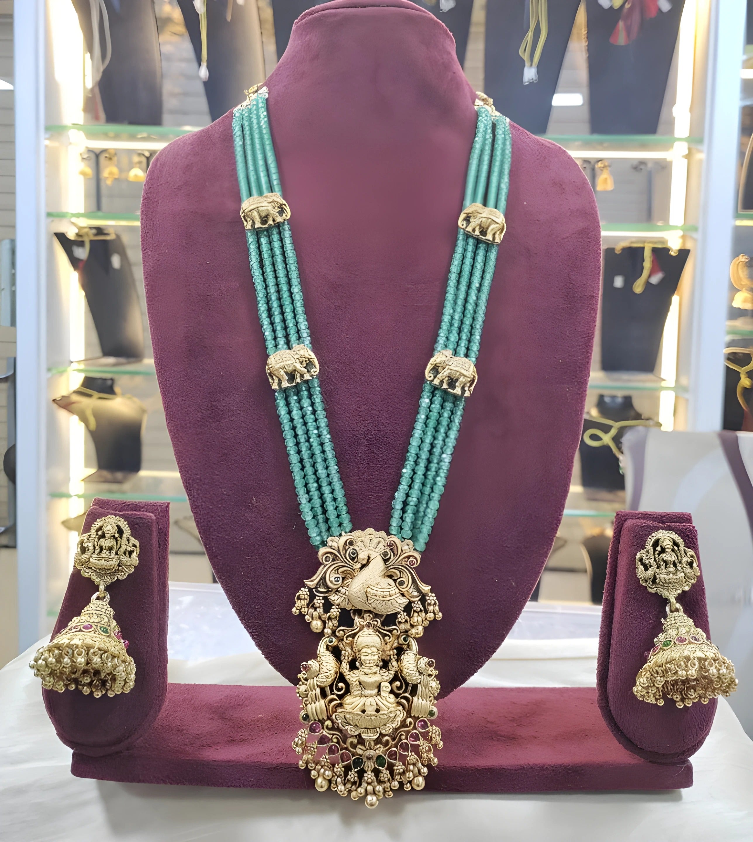 Jewel City Luxurious Emerald Green Temple Goddess Kundan Jewelry Set - Handcrafted Gold-Plated Bridal Necklace with Jhumka Earrings
