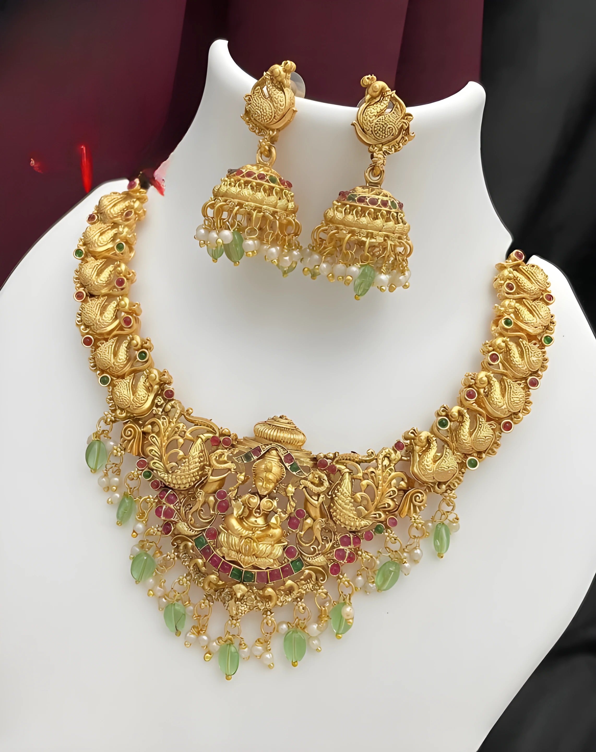 Jewel City Opulent Gold Peacock Lakshmi Temple Necklace Set - Handcrafted Antique Finish Bridal Jewelry with Emerald & Pearl Accent