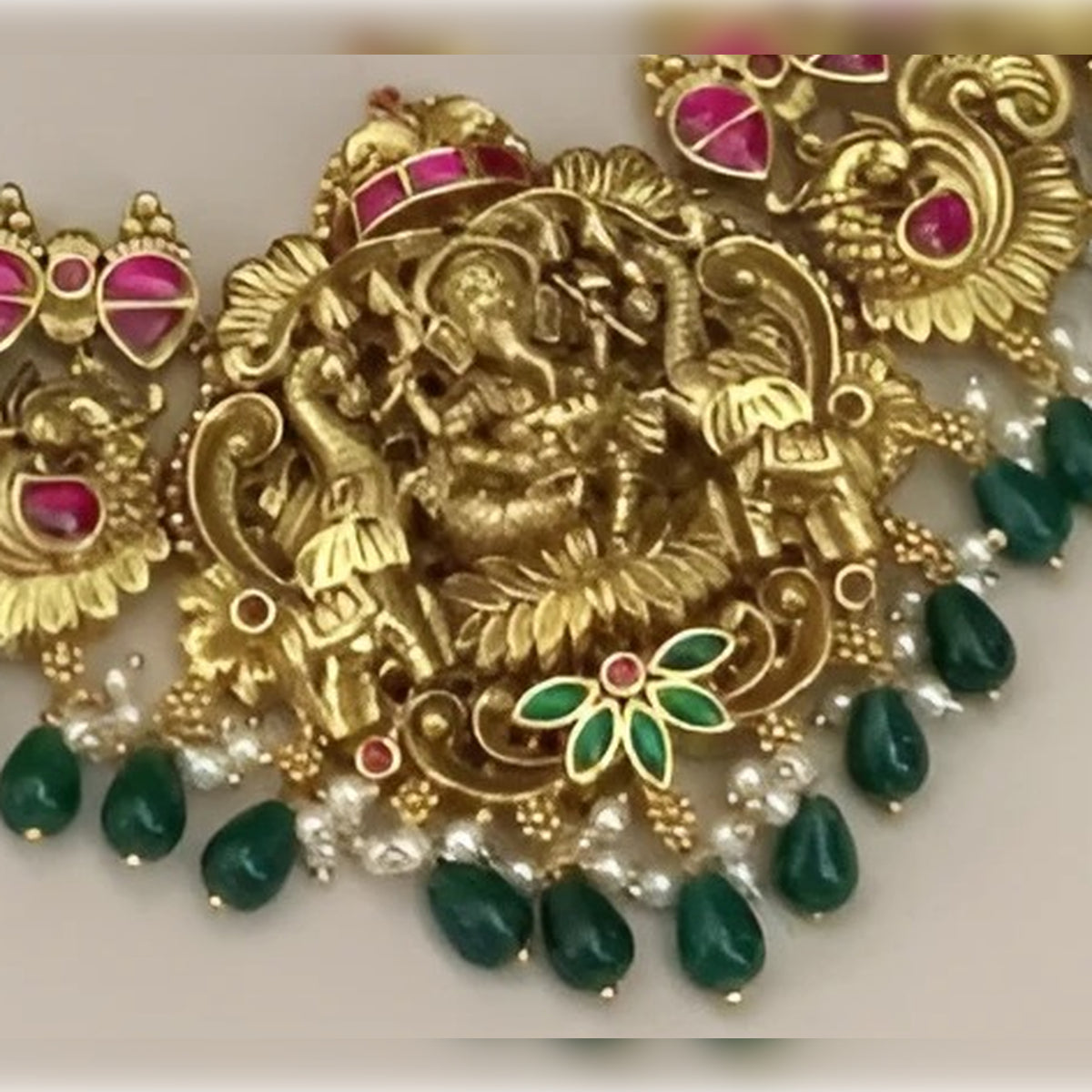Jewel City Ganesha Temple Necklace Set - Antique Gold Finish with Emerald Drops & Ruby Pink Stones (Premium Bridal Collection)