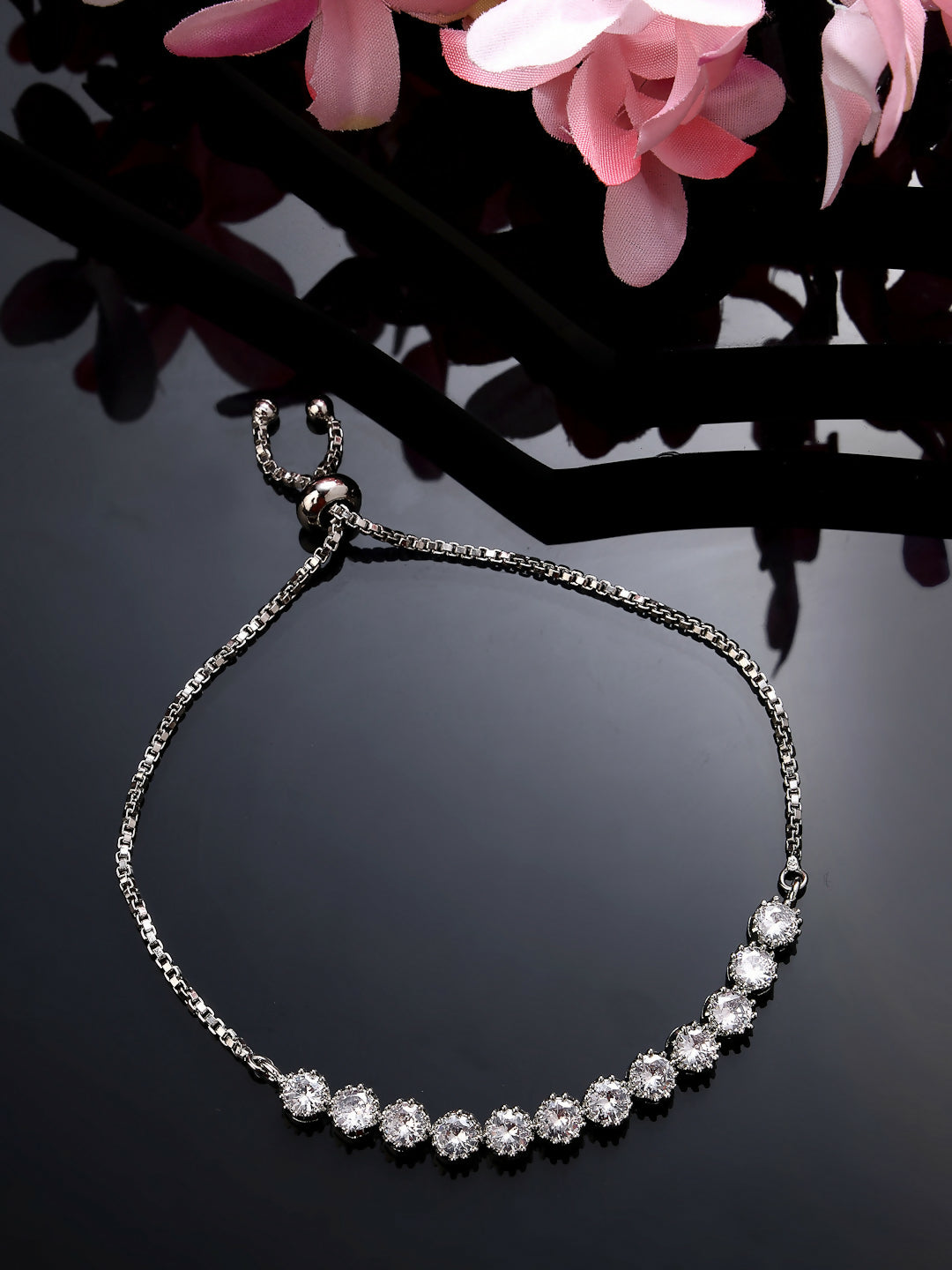 NVR Women Silver-Plated American Diamond Studded Rakhi With Roli Chawal - Distacart